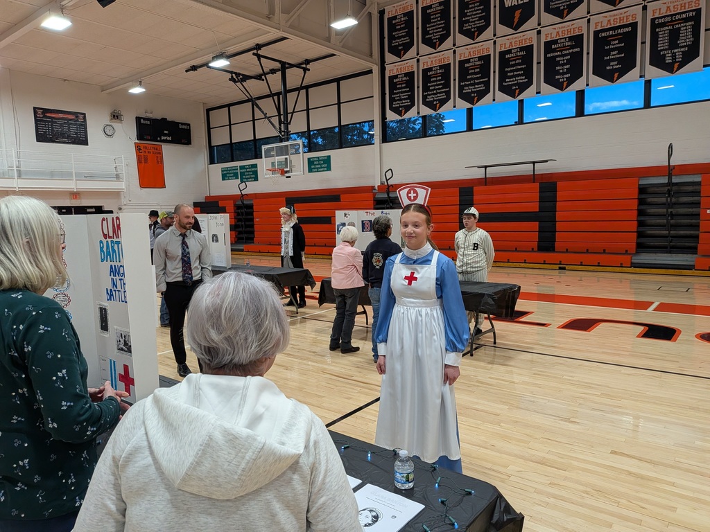 Wax museum exhibits provided by the 8th grade class. Multiple pictures taken at the event.
