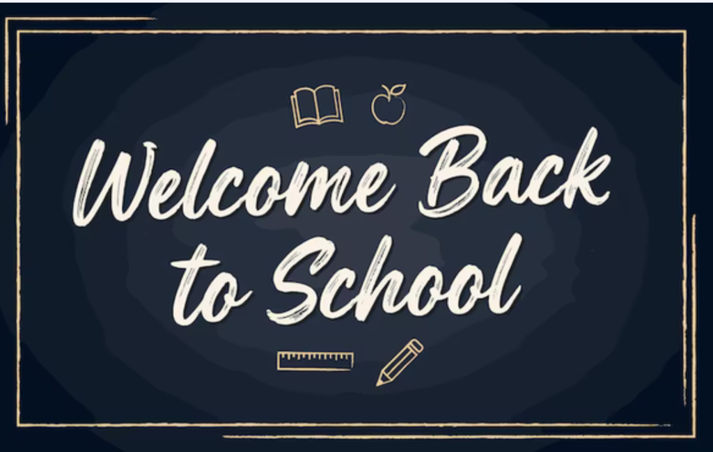 Black chalkboard background with a yellow border and the words welcome back to school written in white.