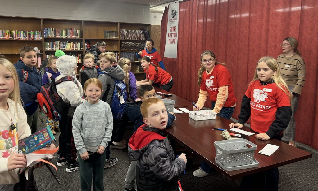 Students depositing funds. 