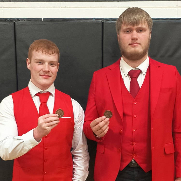 Picture of Steel Marks and Isaac Haack with their 3 place medals, qualifying them for State Speech