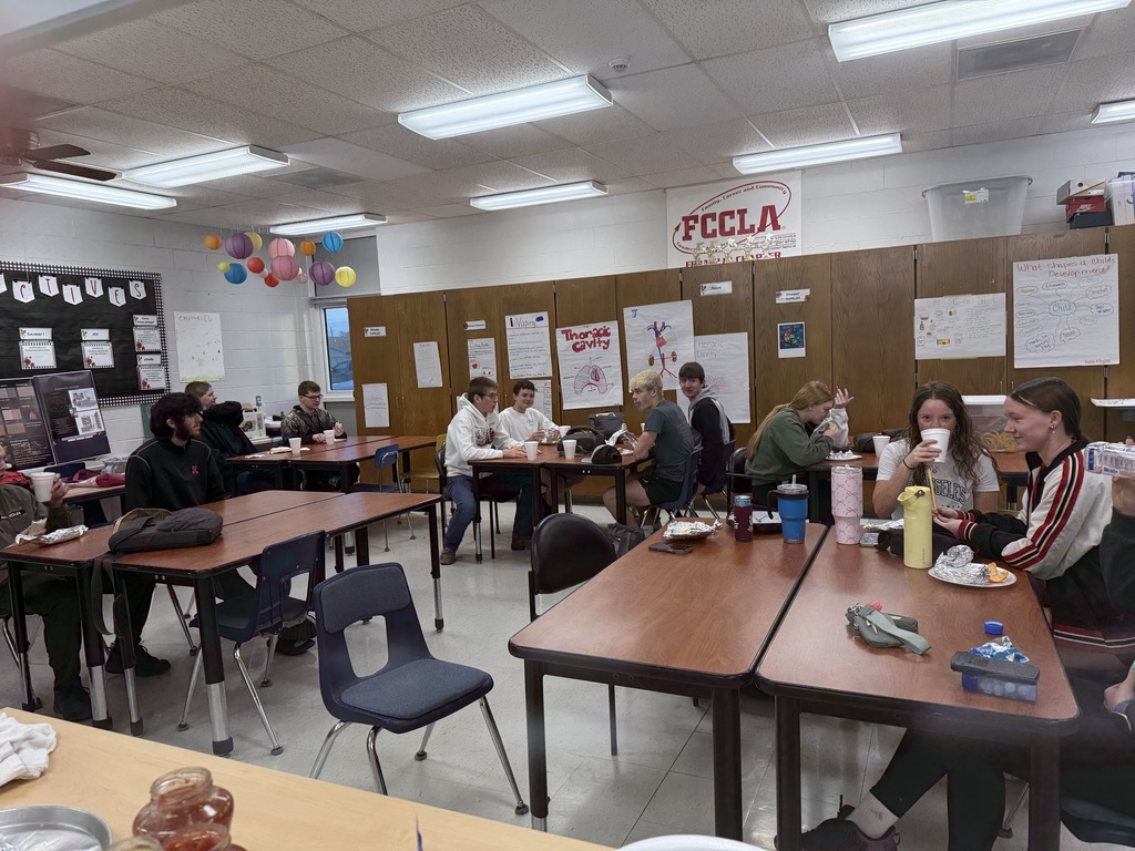 Picture of some of the junior class eating breakfast before taking the ACT.