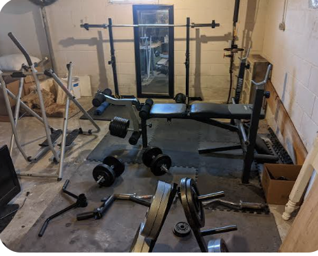 Picture of a messy weight room.  Posted to remind those that use the weight room to keep it clean.  
