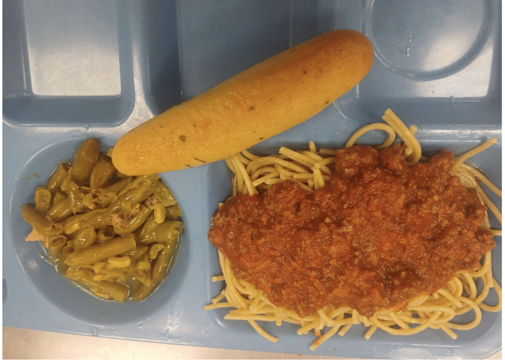 Picture of spaghetti, breadstick and green beans for lunch.