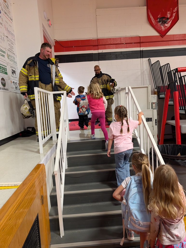 Volunteer firefighters come to the gym for another morning greeting.