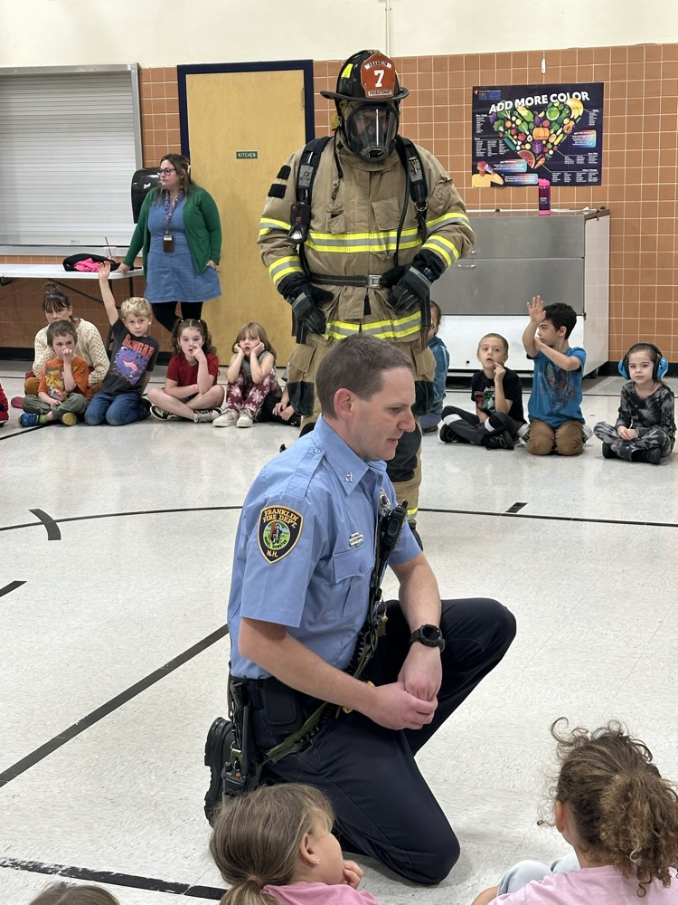 Firefighters present fire safety lessons .