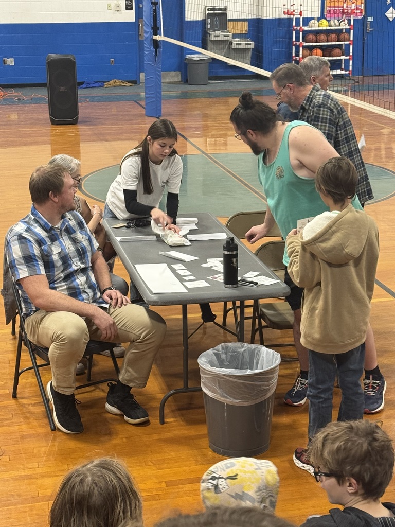 students observe teachers receiving tattoos