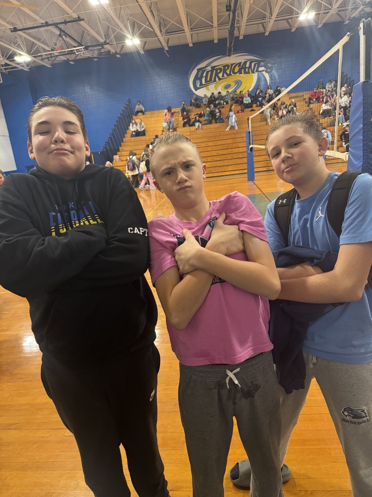 3 Middle School boys posing 