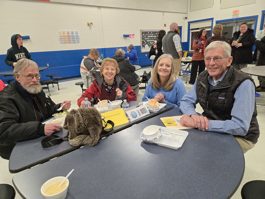 four members of the community posing for the camera