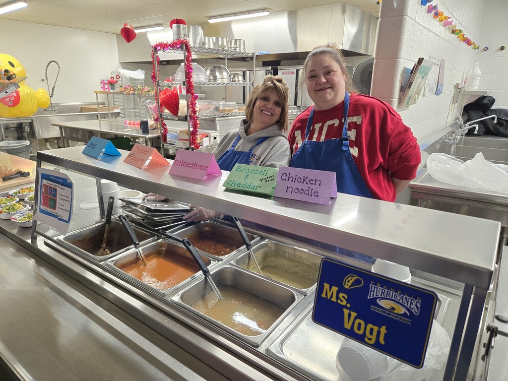 two women serving soup