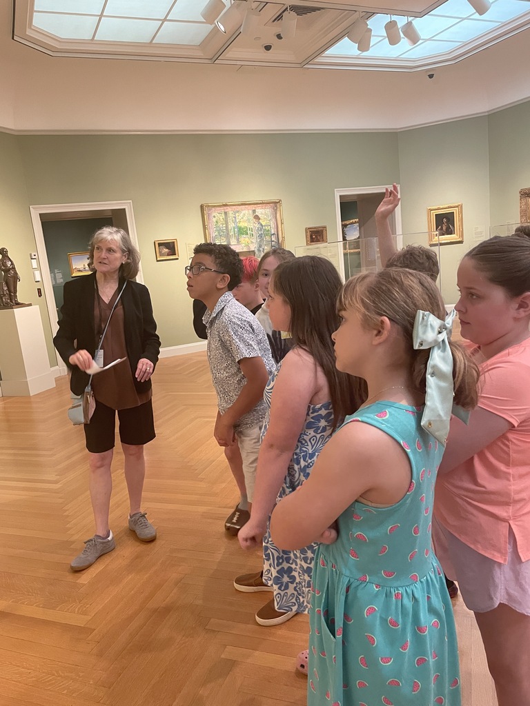 Students offering thoughtful feedback on a piece of artwork!