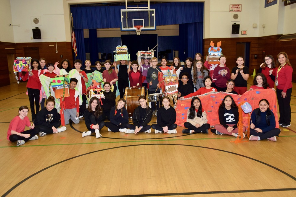 Students with dragon masks and instruments