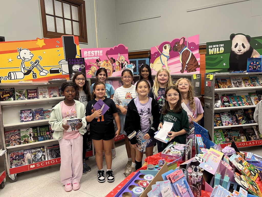 Kids holding books at school bookfair