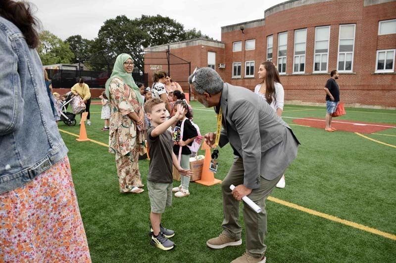 Principal with students.
