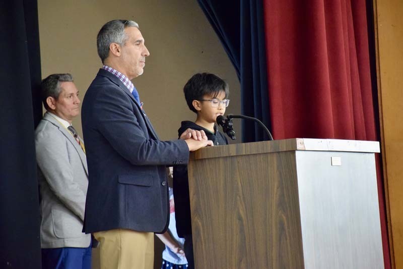 Student speakinStudent speaking at podium.g at podium.