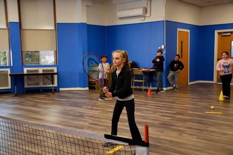 WSS students playing in gymnasium.