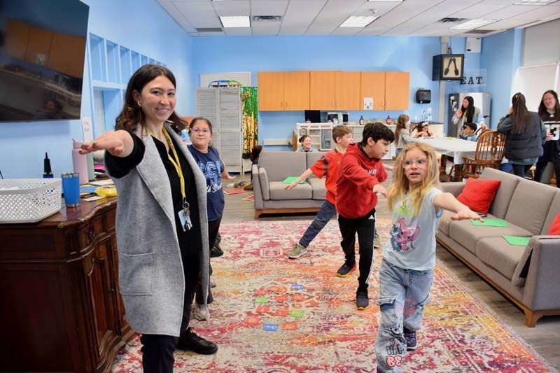 Students posing with teacher.