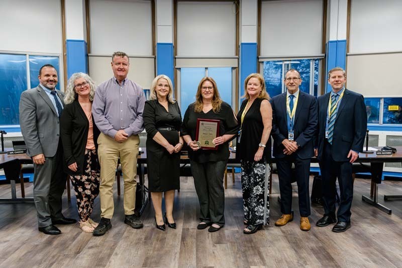 Bboard members standing together.