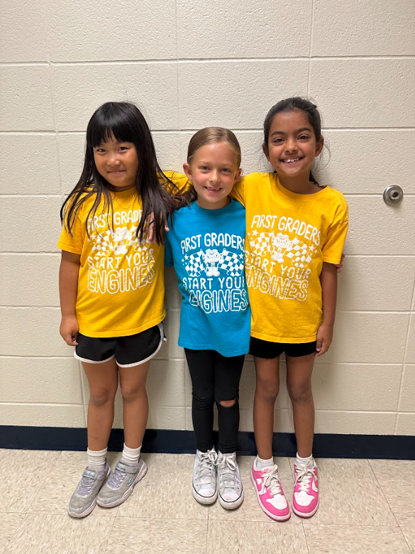 3 students smiling