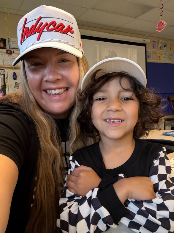 Teacher and student smiling