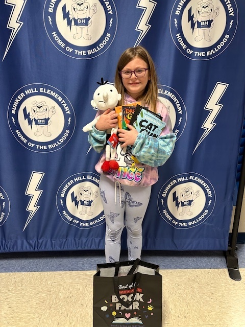 student with book raffle winnings