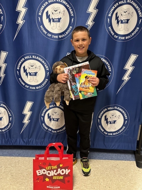 student with book raffle winnings