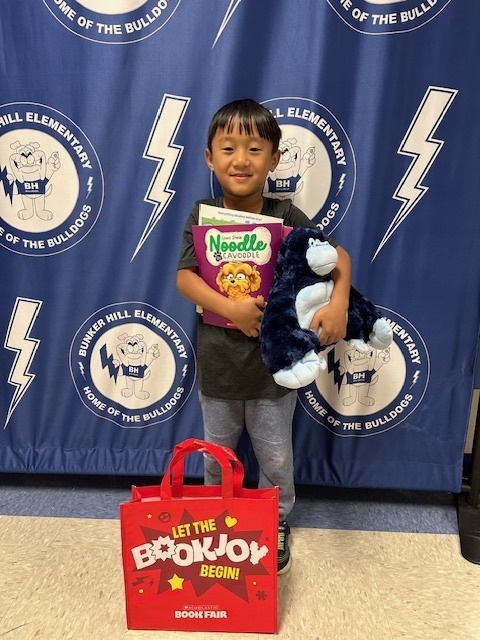 student with book raffle winnings