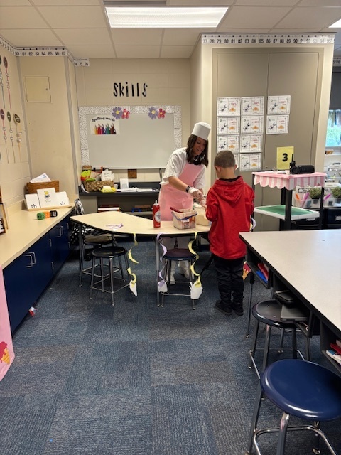 Mrs. Brown serving students ice cream