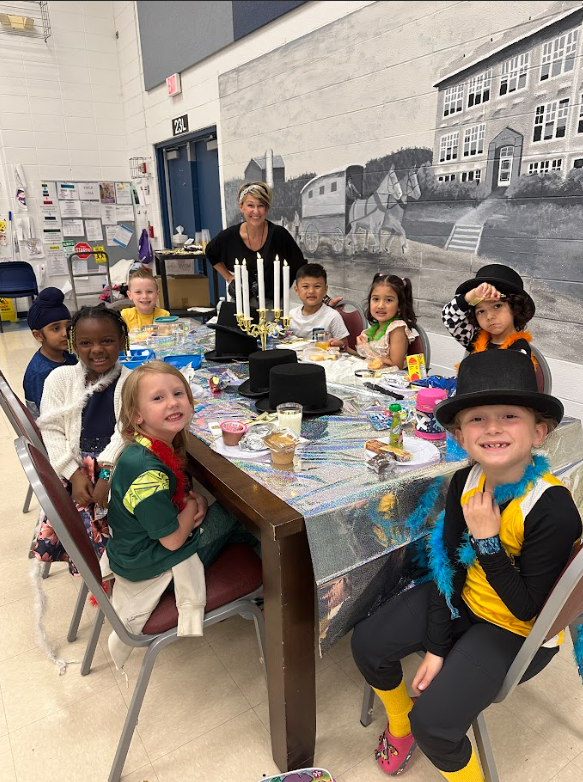Group of students smiling with Mrs. Huff