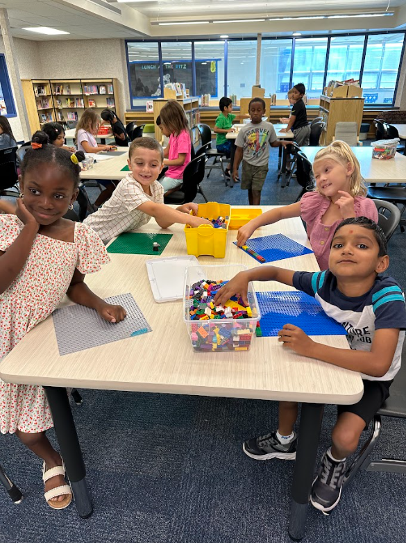 Students playing with Lego bricks