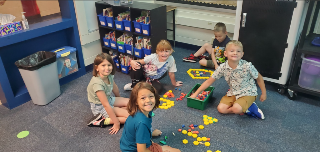 4 first grade students playing