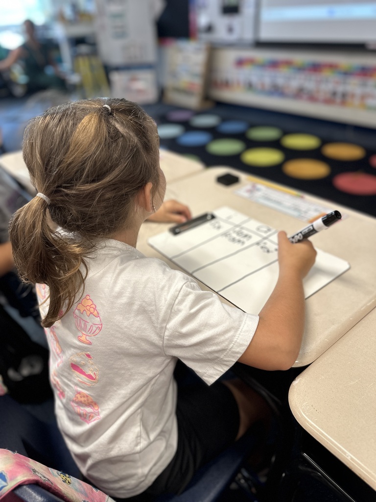 First grade student doing classwork