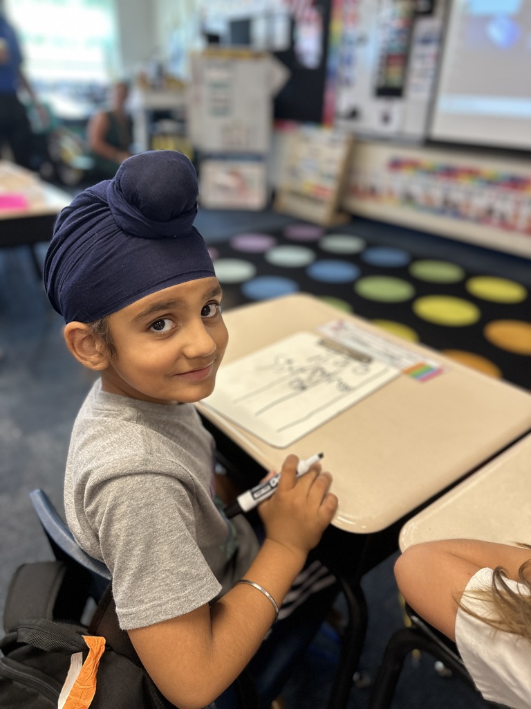 First grade student doing school work