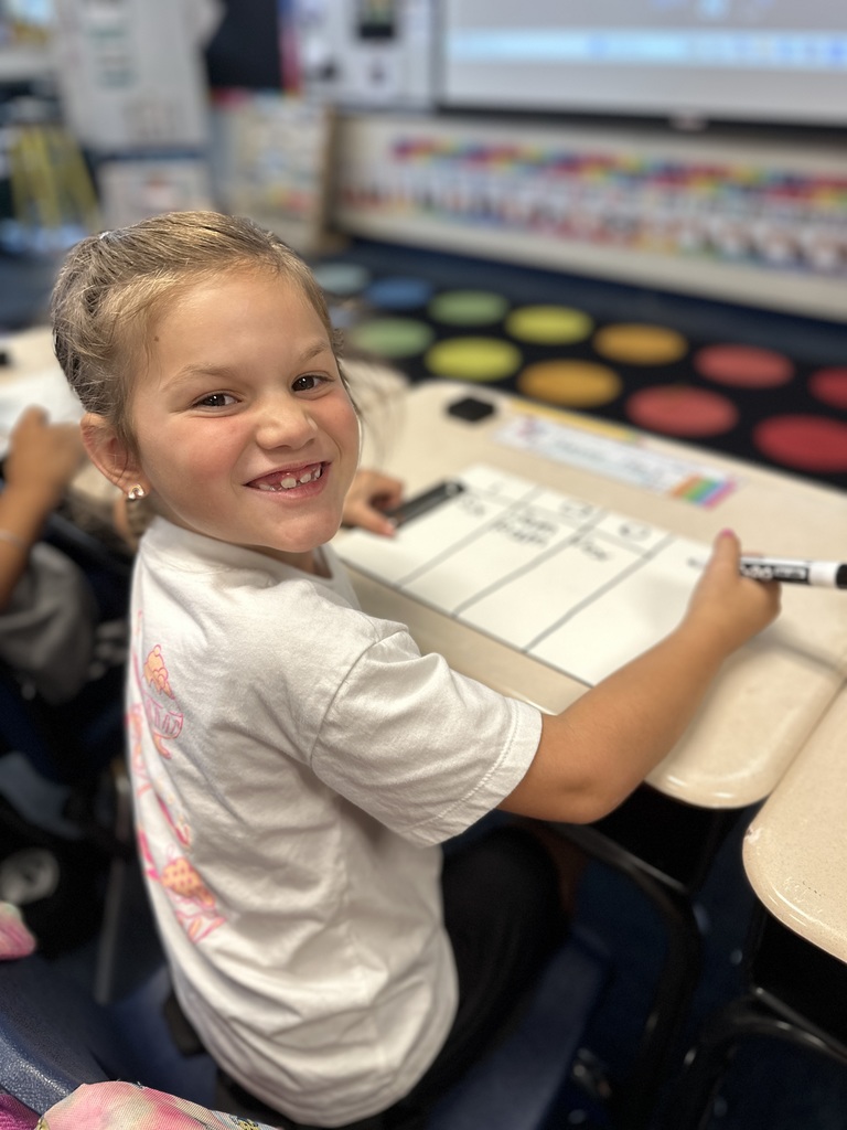 First grade student doing school work