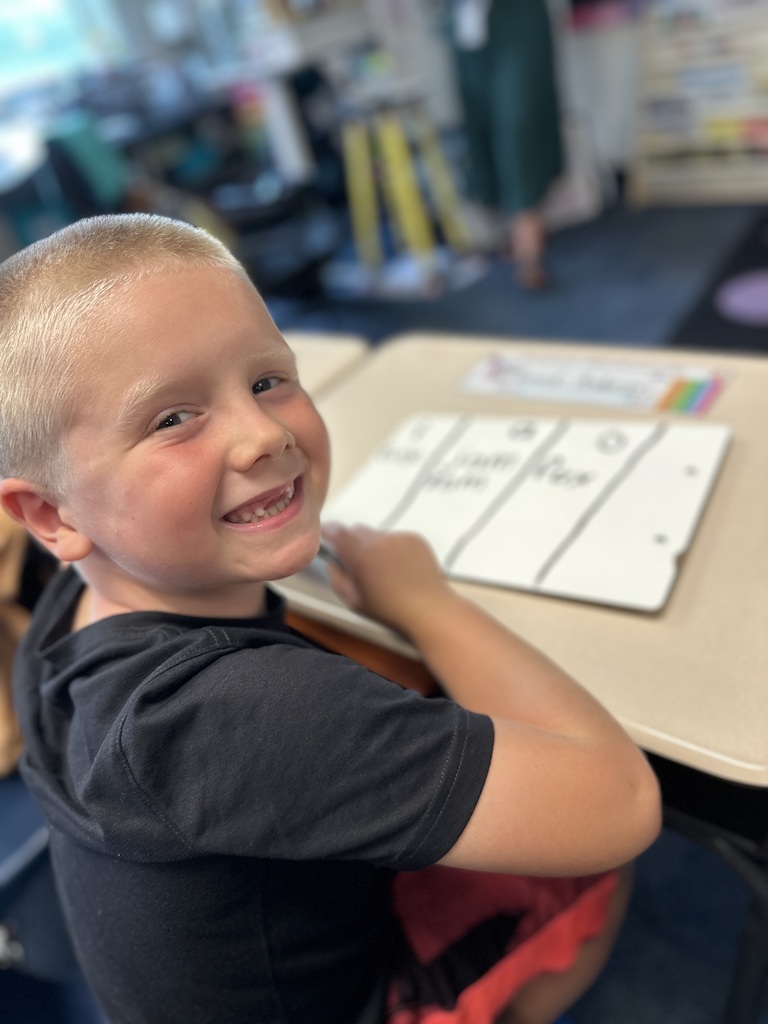 First grade student doing school work