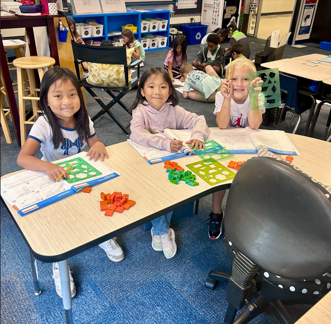 three students working on math