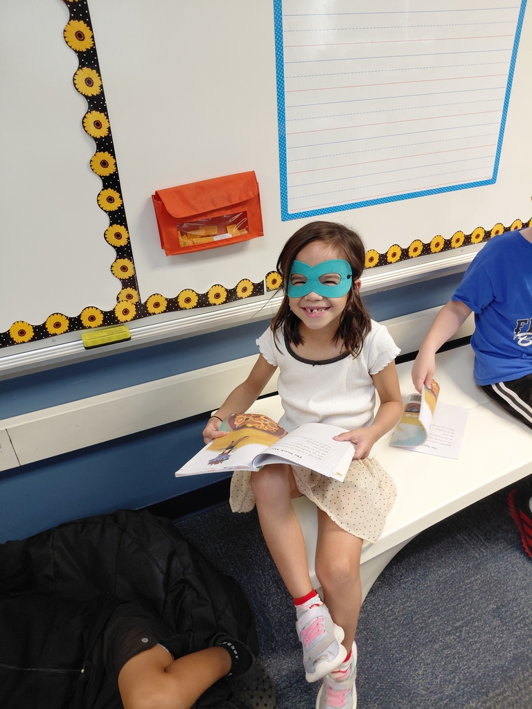 student smiling wearing a mask