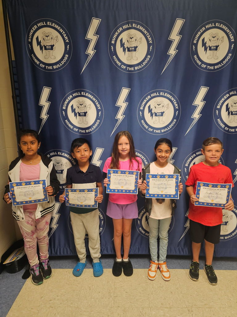 Third grade star students with their certificates