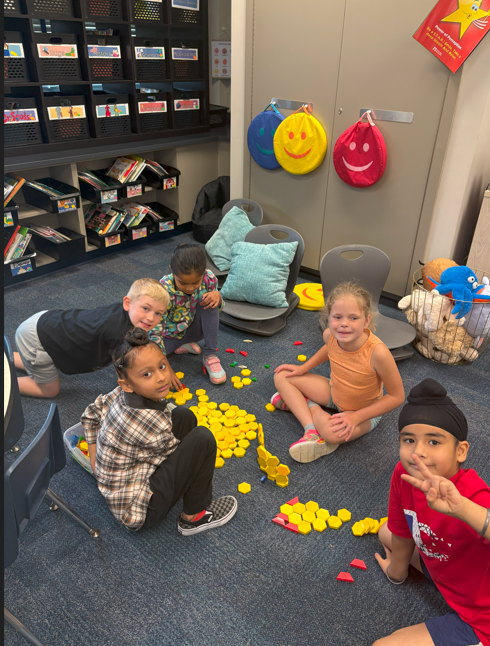 students smiling with geometric shapes