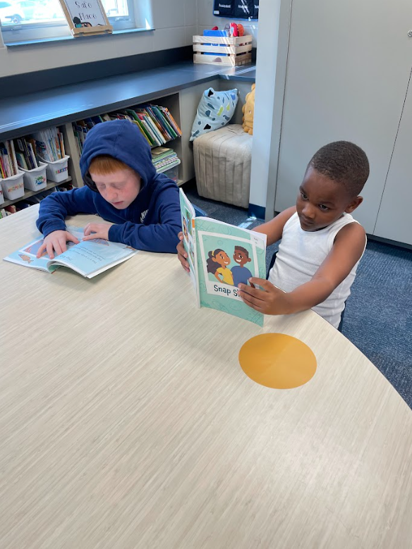 two students reading in partners
