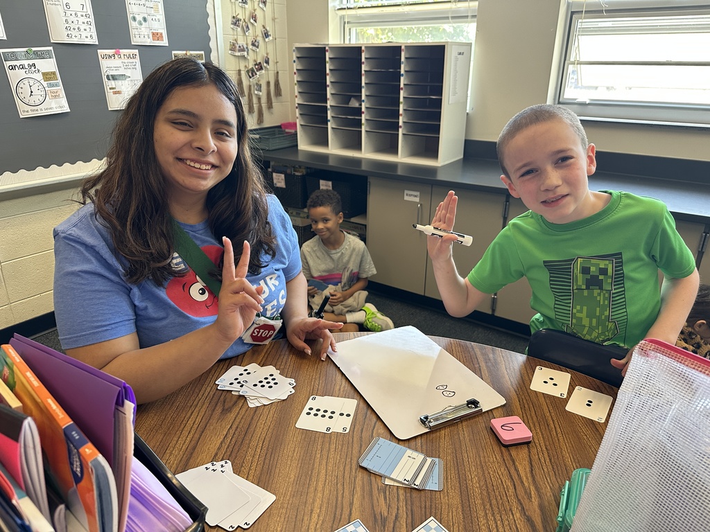 teacher smiling with student