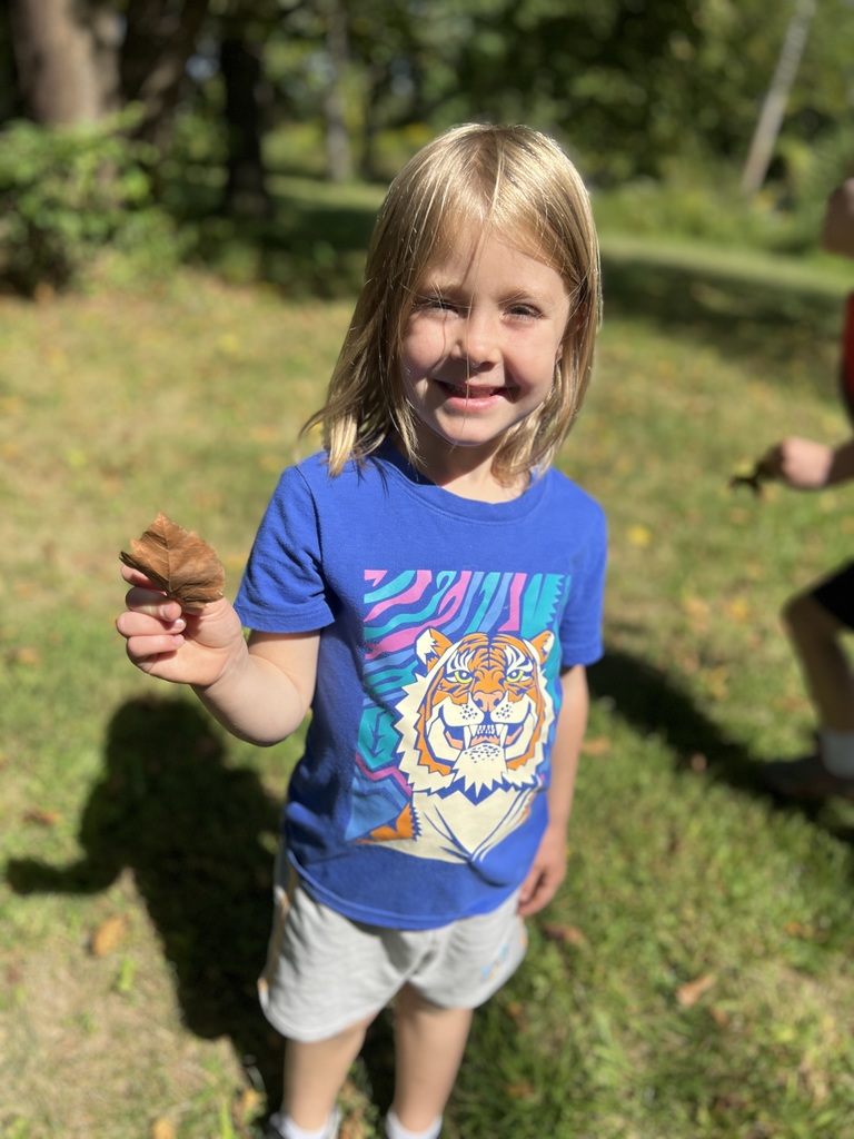 Student holding leaves