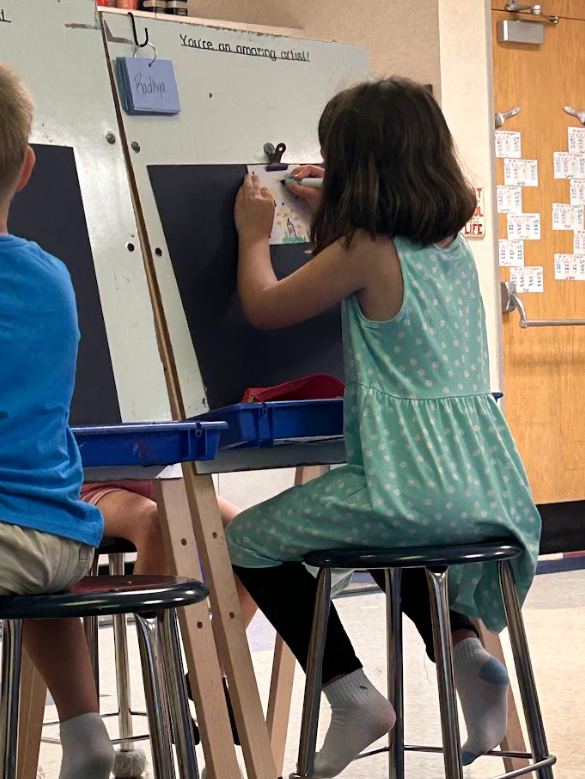 Student decorating a pinwheel