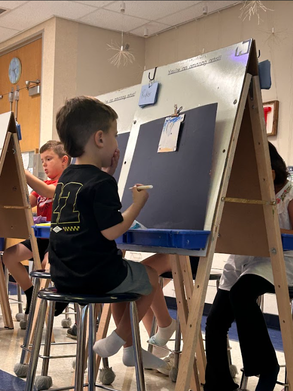 Student decorating a pinwheel