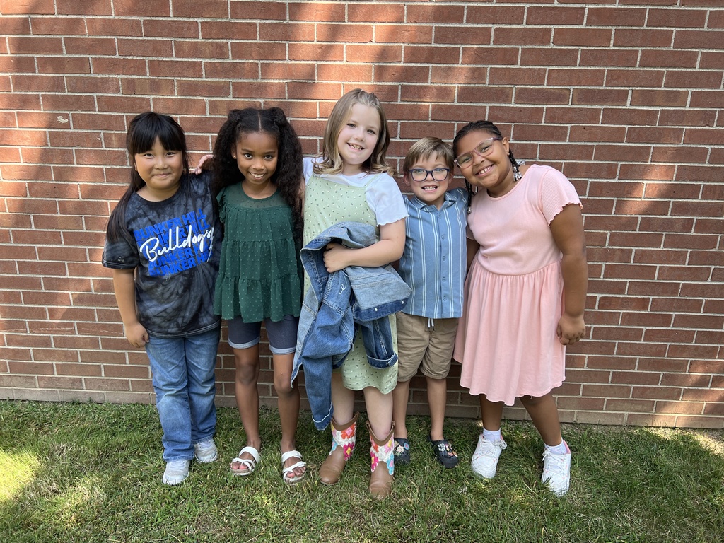 Students smiling together outside