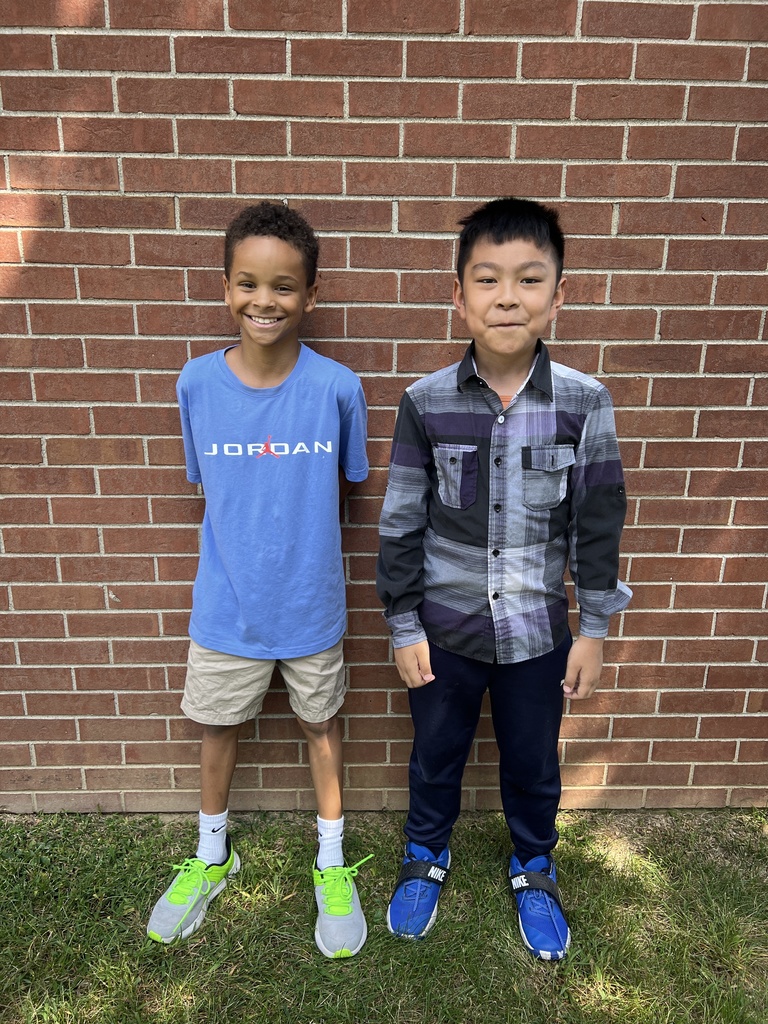 Students smiling together outside