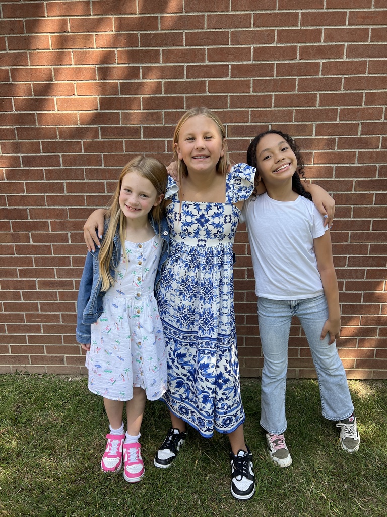 Students smiling together outside