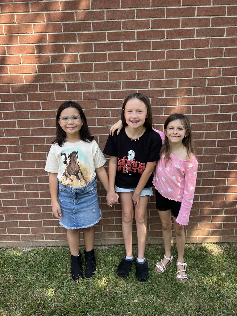 Students smiling together outside