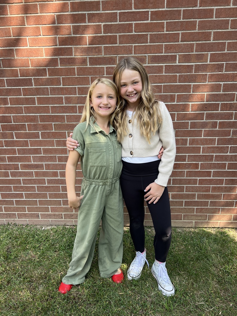 Students smiling together outside