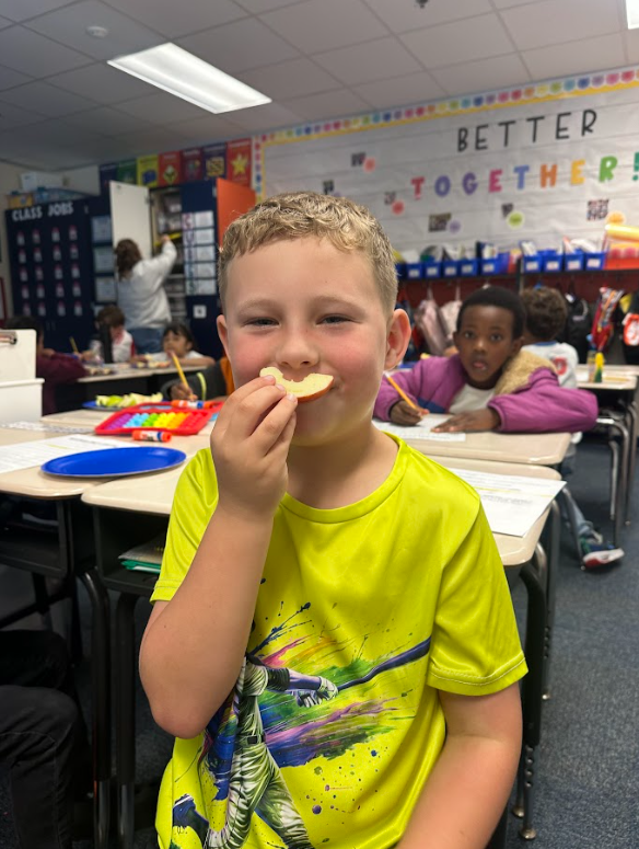 2nd grade students doing apple math