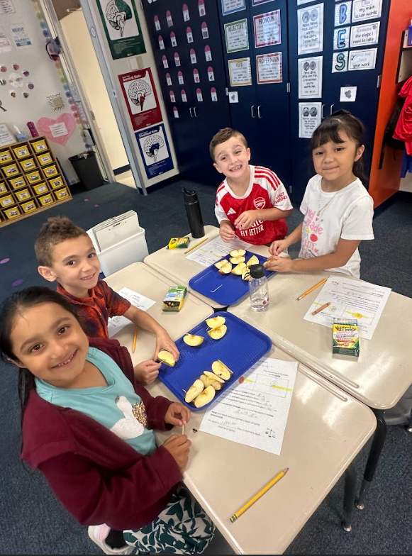 2nd grade students doing apple math